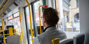 Cameron Linnell sitting on a Manchester tram.